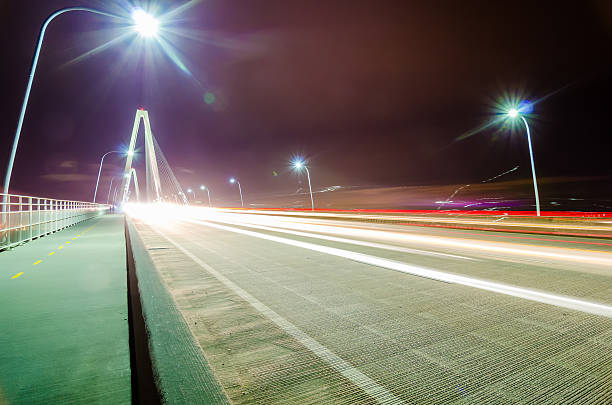 istock traffic commute on bridge at night long exposure 468464790
