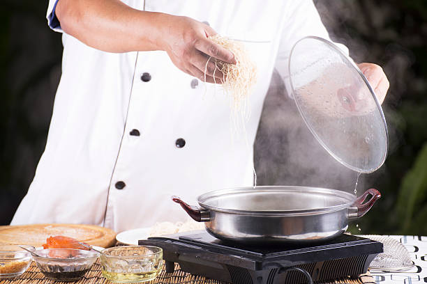 istock Chef putting the noodle to pot 468465366