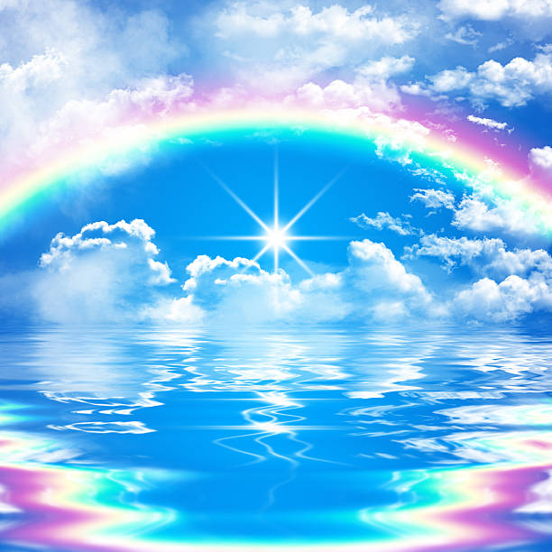 istock romantic seascape with rainbow, clouds and sunshine 468465614