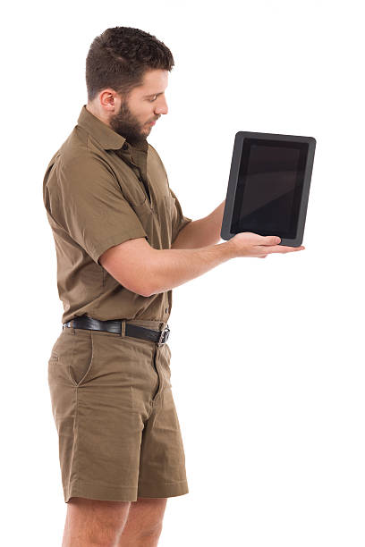 istock Man in khaki uniform showing a shockproof digital tablet. 468465716