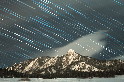 Star Trails over the flatirons in Boulder Colorado during winter