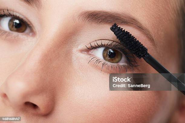 Portrait Of Young Woman Applying Mascara Close Up Stock Photo - Download Image Now - Accuracy, Adult, Adults Only