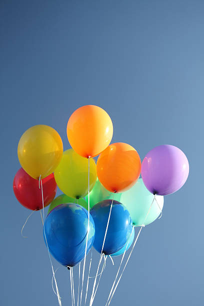 istock Colorful balloons in a clear blue sky 468469773