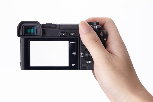 Compact digital camera holding in hand