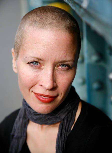 istock Woman with a shaved head smiles. 468471040