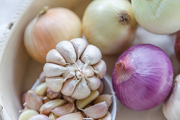 istock Onions and garlic in the basket 468471164