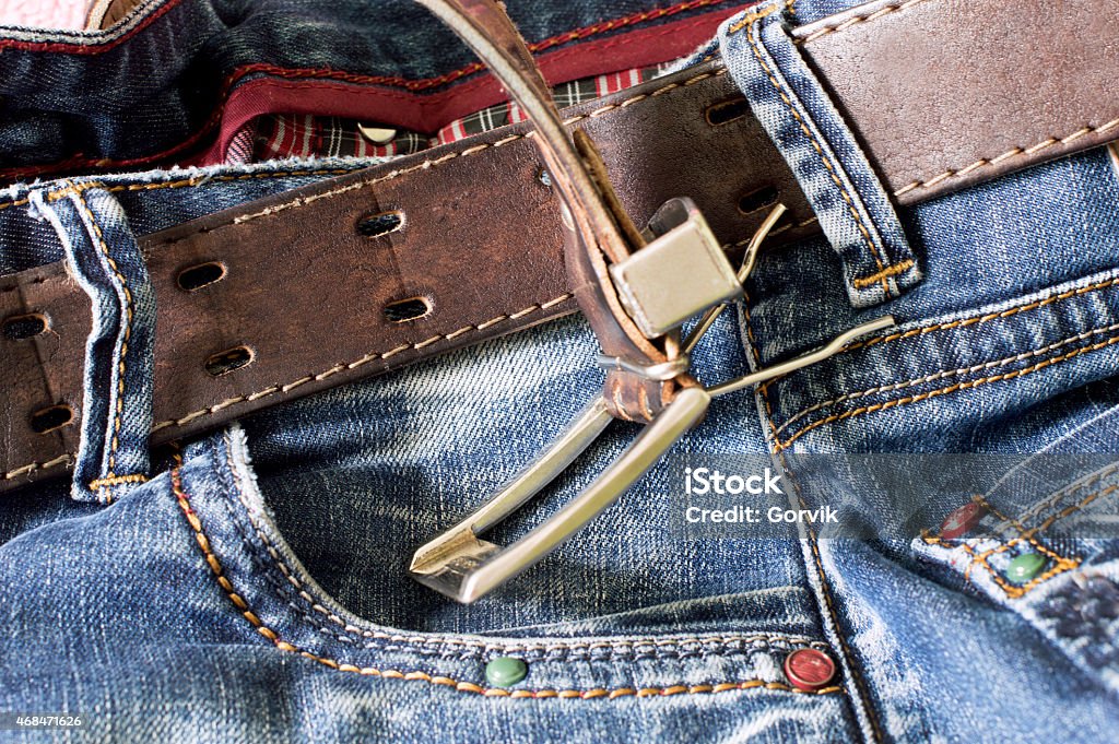 Textile: blue jeans with a brown leather belt Texture - Textile: blue jeans with a brown leather belt and buckle 2015 Stock Photo