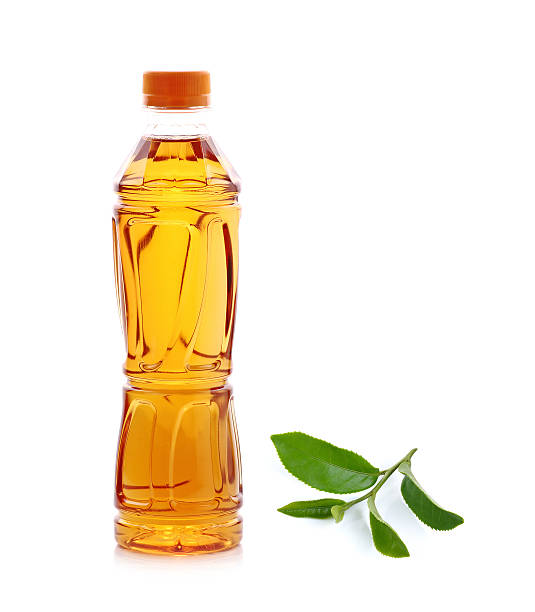 Bottle of green tea with tea leaf isolated on white background.