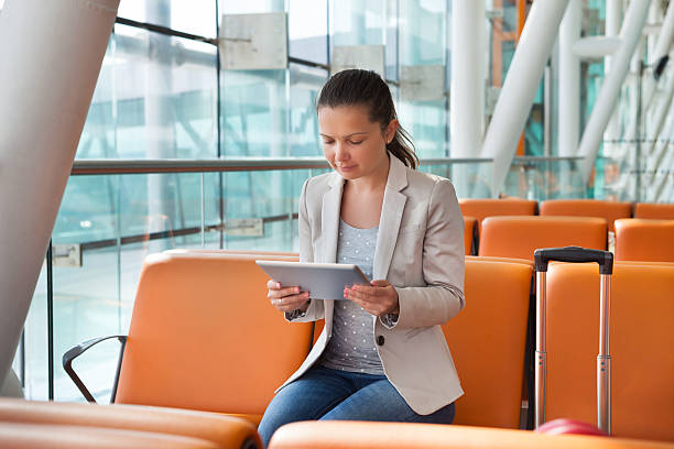 istock Businesswoman Using Digital Tablet At Airport Lobby 468472794