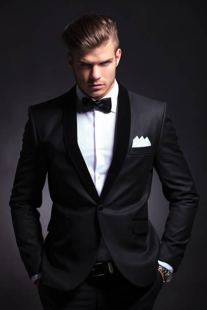 istock business man holds his hands in pockets 468472809