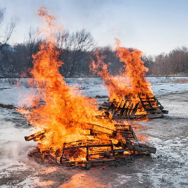Photo of Two Pallet Fires Burn Brightly