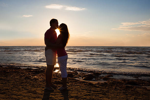istock Couple Kissing At Beach During Sunset 468473110