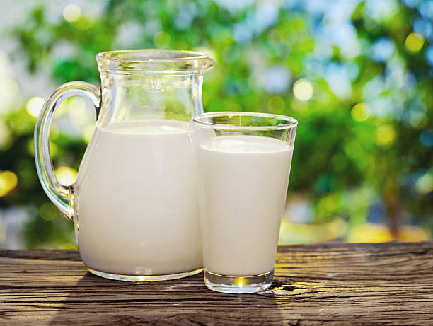 istock Milk in jar and glass. 468473410