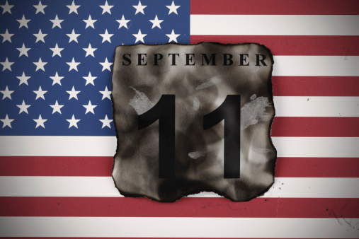 September 11 burnt calendar's page and American flag.