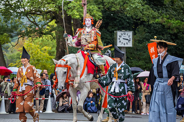 Jidai Matsuri in Kyoto, Japan Kyoto, Japan - October 22 2014: Unidentified participants at the "Historical Parade (Jidai Matsuri)", one of Kyoto's renowned three great festivals held on 22nd October every year heian period stock pictures, royalty-free photos & images