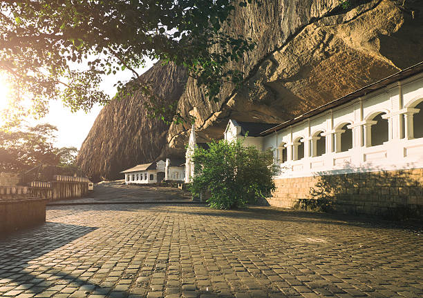 Dambulla rock cave temple at sunrise Dambulla rock cave temple at sunrise dambulla stock pictures, royalty-free photos & images