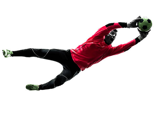 europäischer abstammung soccer player-goalkeeper mann, fangen ball silhouette - torhüter stock-fotos und bilder