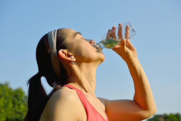 istock woman drinking water 468484226
