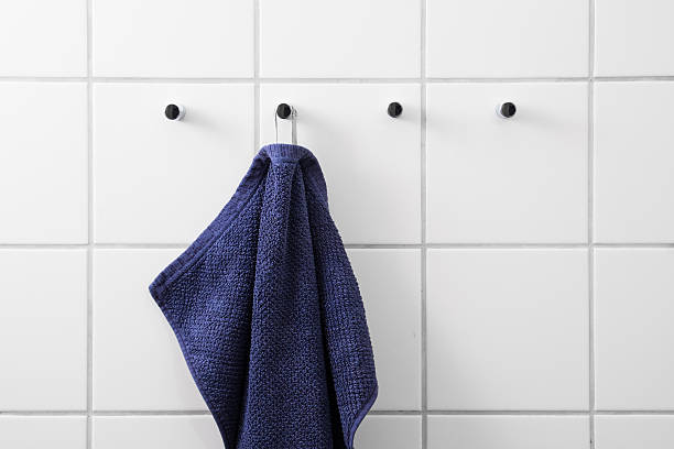 Blue towel white tiles stock photo