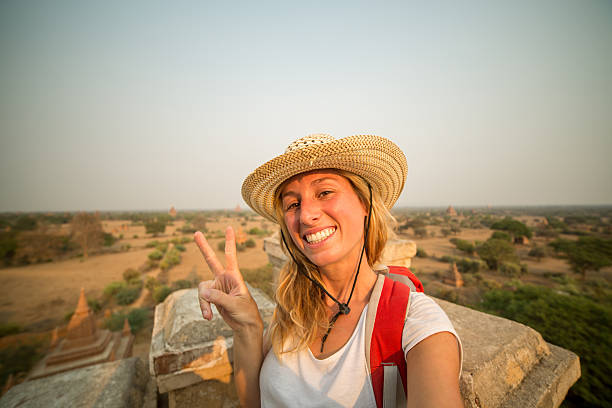 istock Cheerful tourist taking selfie in Bagan-Myanmar 468487036