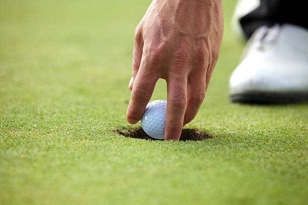 istock Person holding golf ball, close-up 468487700