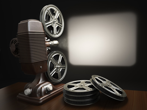 Cinema, movie or video concept. Vintage projector with projectin