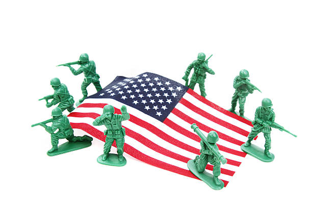 istock Toy soldiers around an American flag 468488984
