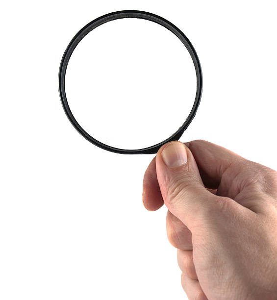 istock hand and magnifying glass isolated 468489524