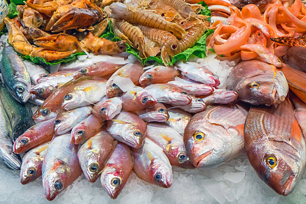 Tasty fish and seafood Tasty fish and seafood for sale at a market fish market stock pictures, royalty-free photos & images