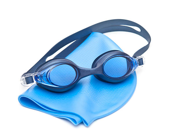 Blue swimming cap and goggles Blue swimming cap and goggles swimming goggles stock pictures, royalty-free photos & images