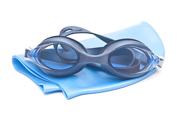 istock Blue swimming cap and goggles isolated on white 468490763