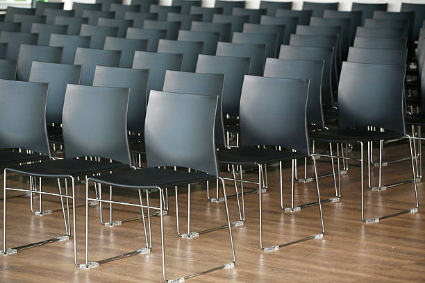 istock Rows of empty chairs prepared for an indoor event 468491576