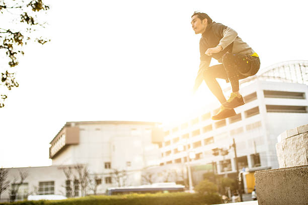 istock Japanese man jumping high on the city 468495762