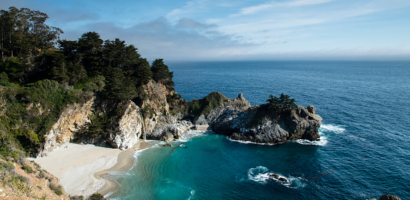 McWay Falls is an 80-foot waterfall located in Julia Pfeiffer Burns State Park that flows year-round. This waterfall is one of only two in the region that are close enough to the ocean to be referred to as 