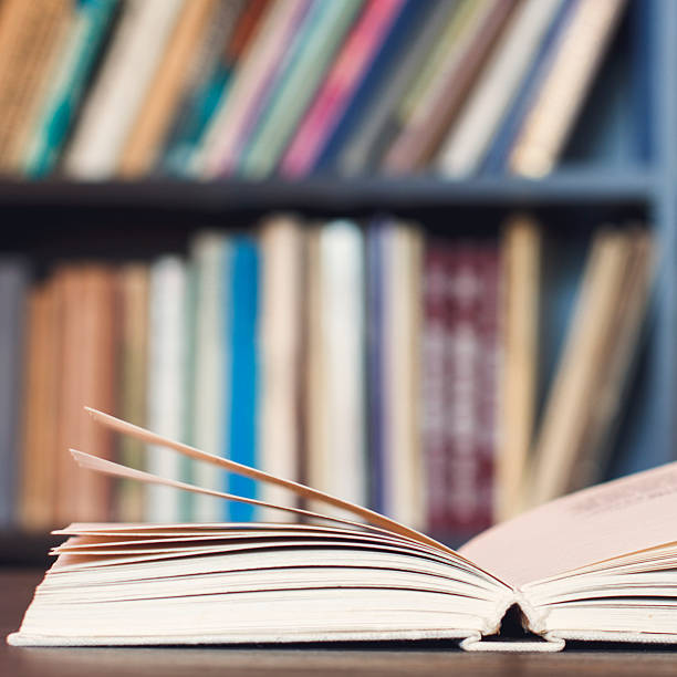 istock Open Book On Wooden Desk. 468496714
