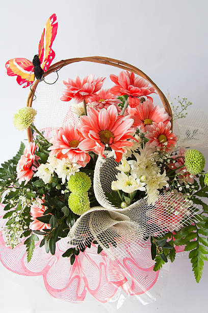 istock butterfly on a basket of flowers 468500340