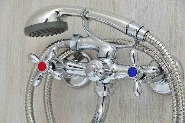istock chrome faucet with showerhead 468505254