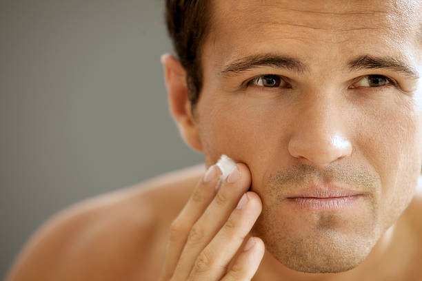 istock Close-up of young man applying shaving cream 468508764