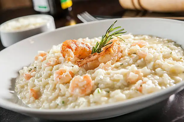 Shrimp risotto served at the table