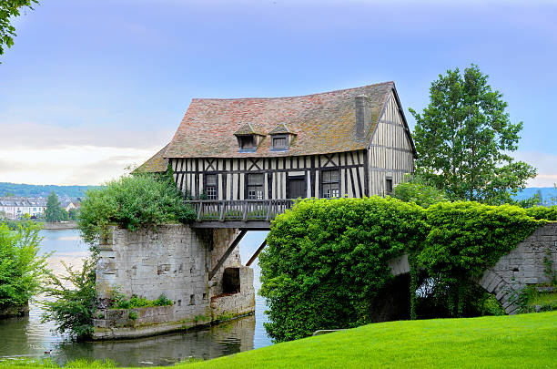 Old mill house on bridge, Seine river, Vernon, Normandy Old mill house on bridge, Seine river, Vernon, Normandy, France normandy stock pictures, royalty-free photos & images
