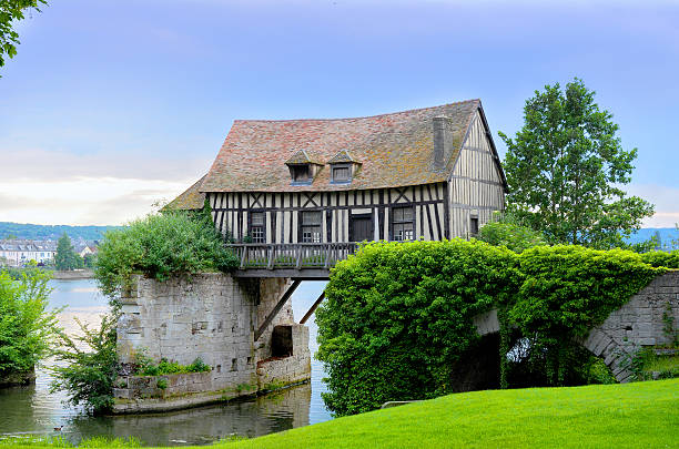 old mill house on bridge, seine river, vernon, normandy - normandiya stok fotoğraflar ve resimler