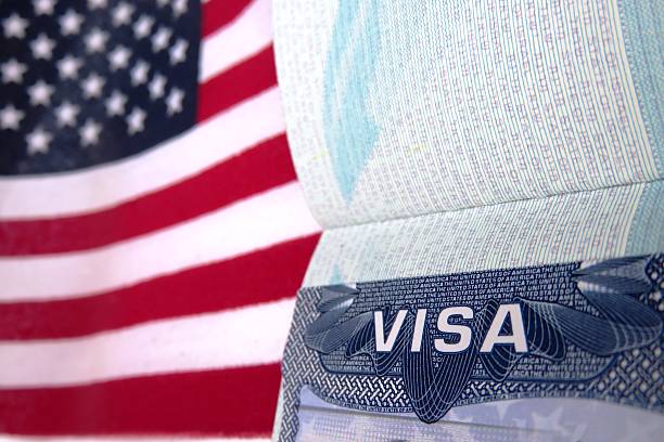 Passport book with Visa paper open on red and white stripes