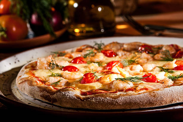 Pizza Pizza with food in the background pizzeria stock pictures, royalty-free photos & images