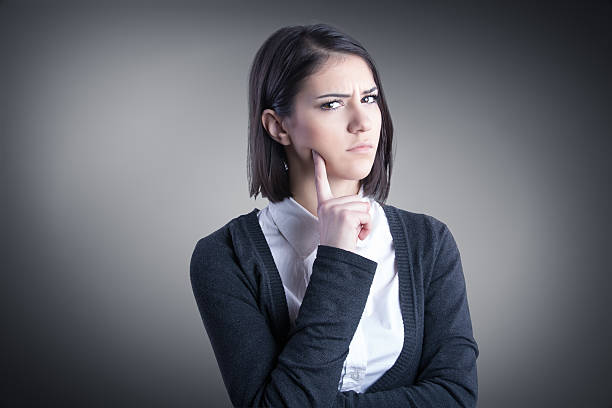 istock Thinking woman standing pensive contemplating looking up for inspiration 468518686