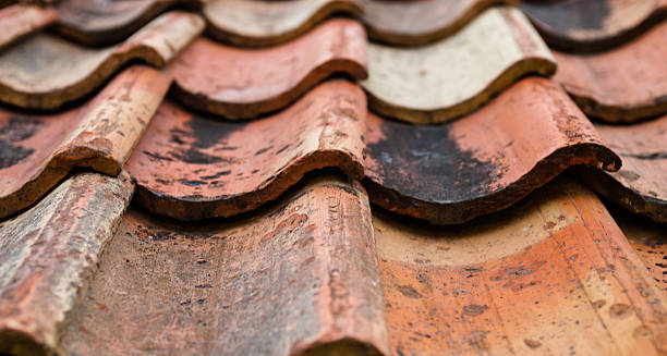 istock The old roof covered with orange tiles 468521214