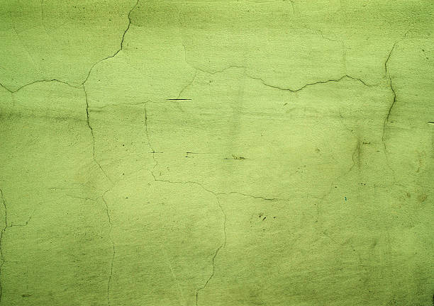 istock Texture of old wall covered with green stucco 468522568