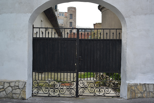 old iron gate in urban setting
