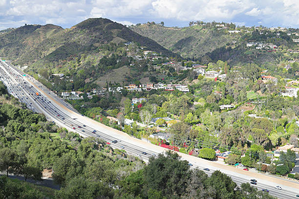 Freeway 405 - Sepulveda Pass - Los Angeles Interstate 405 is a north–south highway in Southern California running along the western and southern parts of Los Angeles from Irvine to San Fernando. It is a heavily traveled and is the most congested freeway in the United. It crosses over the Sepulveda Pass in the Santa Monica Mountains. highway 405 photos stock pictures, royalty-free photos & images