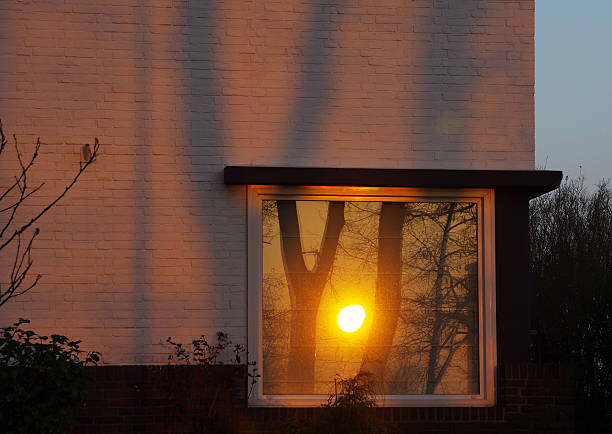 istock Reflection in window of the sunrise 468526094