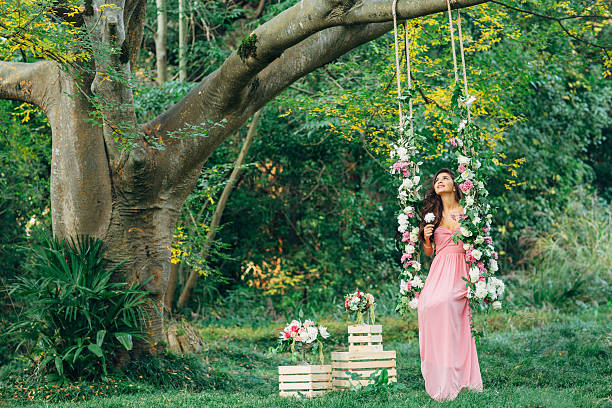 istock Beautiful young girl on a swing 468528890